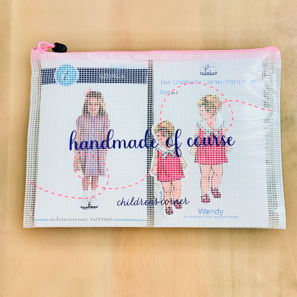 Clear mesh zip pouch with pink zipper printed with handmade of course childrens corner