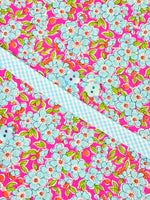 Louise Dress Kit with pink floral fabric, blue gingham trim, and light blue buttons