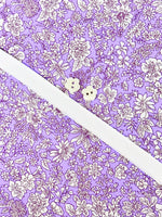 Purple floral cotton fabric with white buttons and white elastic for Louise Dress Kit