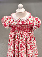 Red floral smocked toddler dress with white Peter Pan collar and puff sleeves