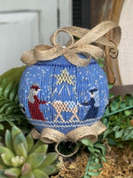 Blue smocked Christmas ornament with nativity scene and burlap ribbon bow