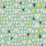 Mint green knit fabric with multicolor triangles in yellow, navy, peach, and light blue