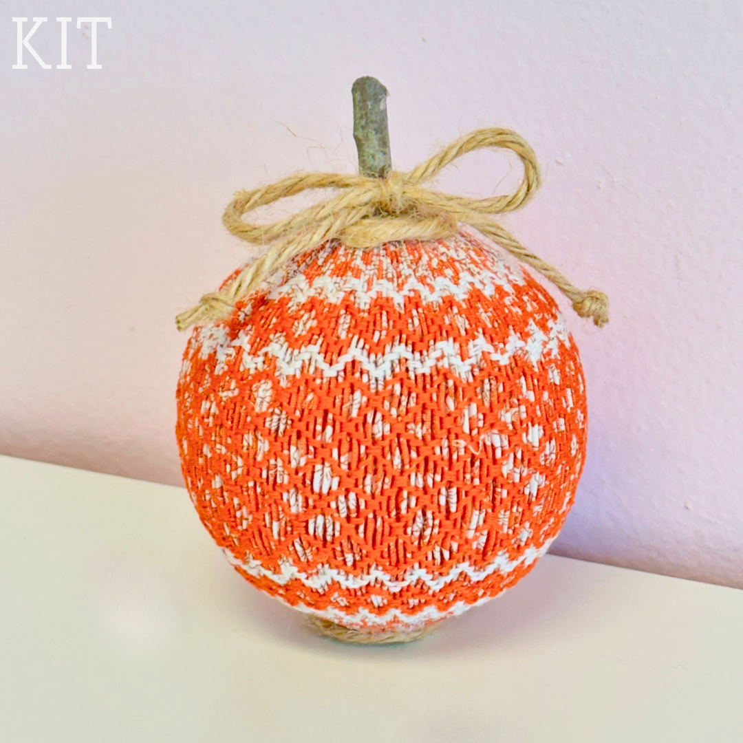 Orange and white smocked pumpkin with twine bow and stem, fall decor kit