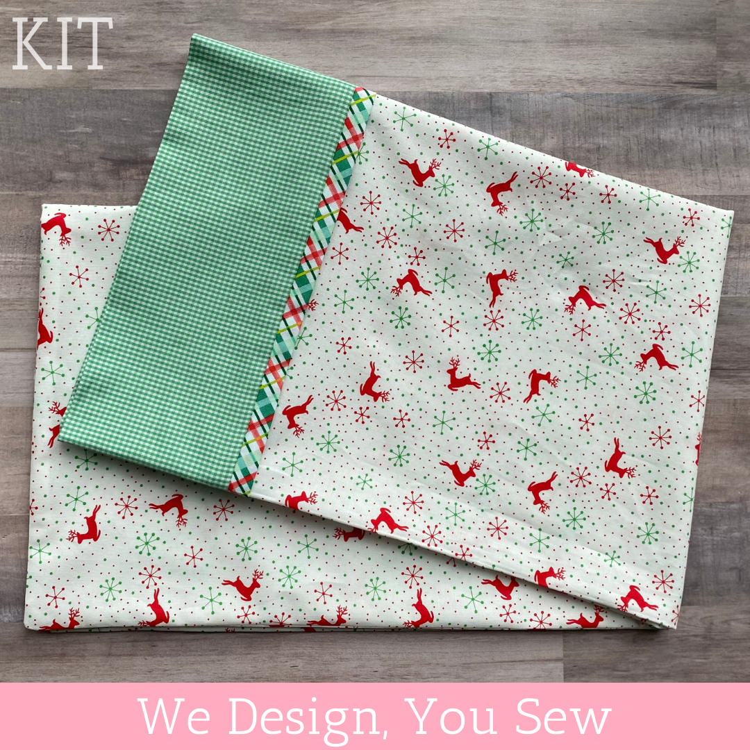 Christmas pillowcase kit with red reindeer print and green gingham fabric panels