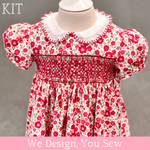 Red floral smocked baby dress kit with white Peter Pan collar and puff sleeves