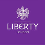 Liberty London purple logo with ornate crest, fabric brand identifier