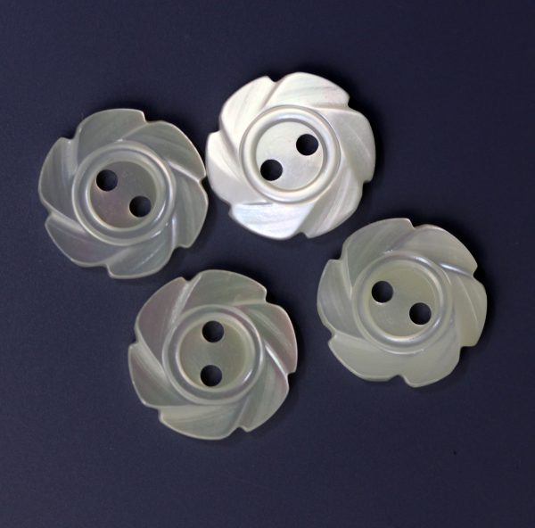 Four iridescent mother of pearl rose-shaped buttons with two holes, pearlescent white
