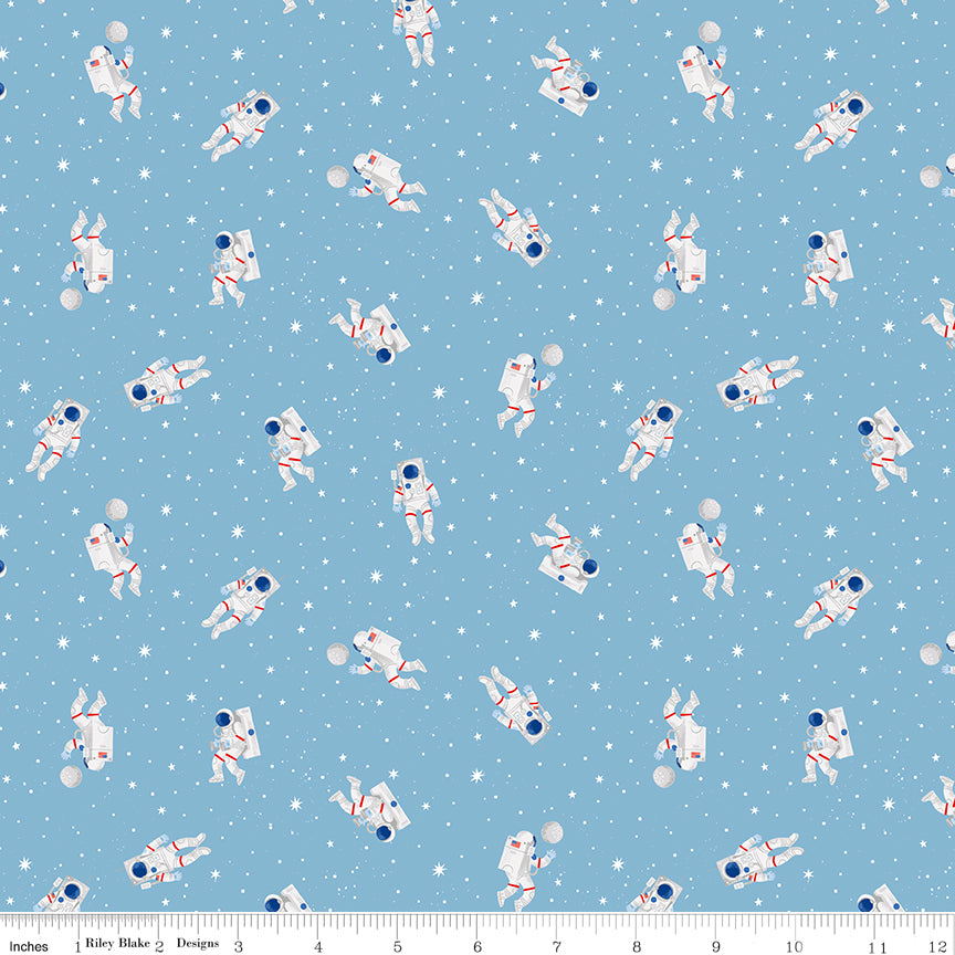NASA space fabric with astronauts floating among stars on sky blue background with ruler