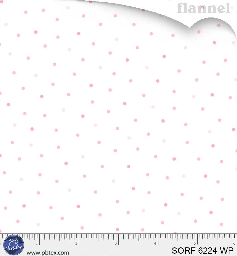 White flannel fabric with scattered pink polka dots in varying shades, soft toss pattern
