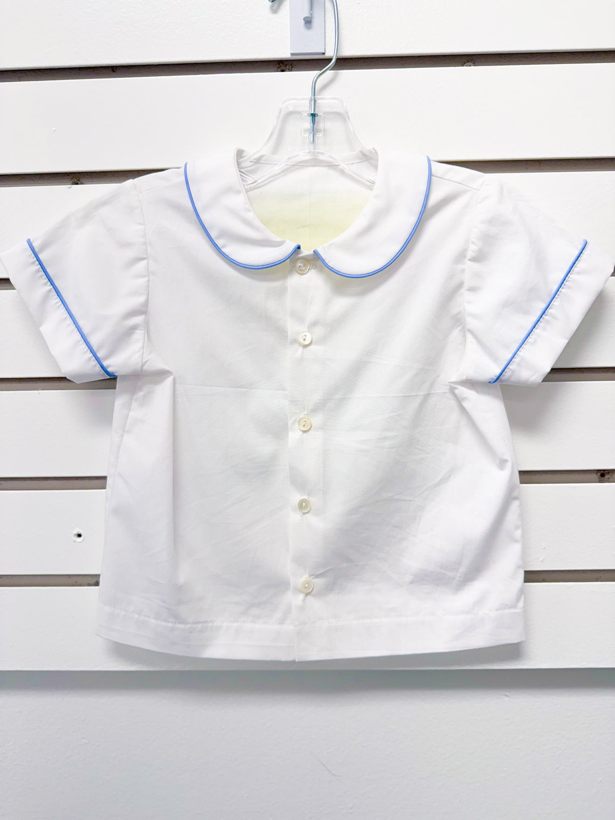 White toddler boy short-sleeve shirt with blue piping trim and Peter Pan collar