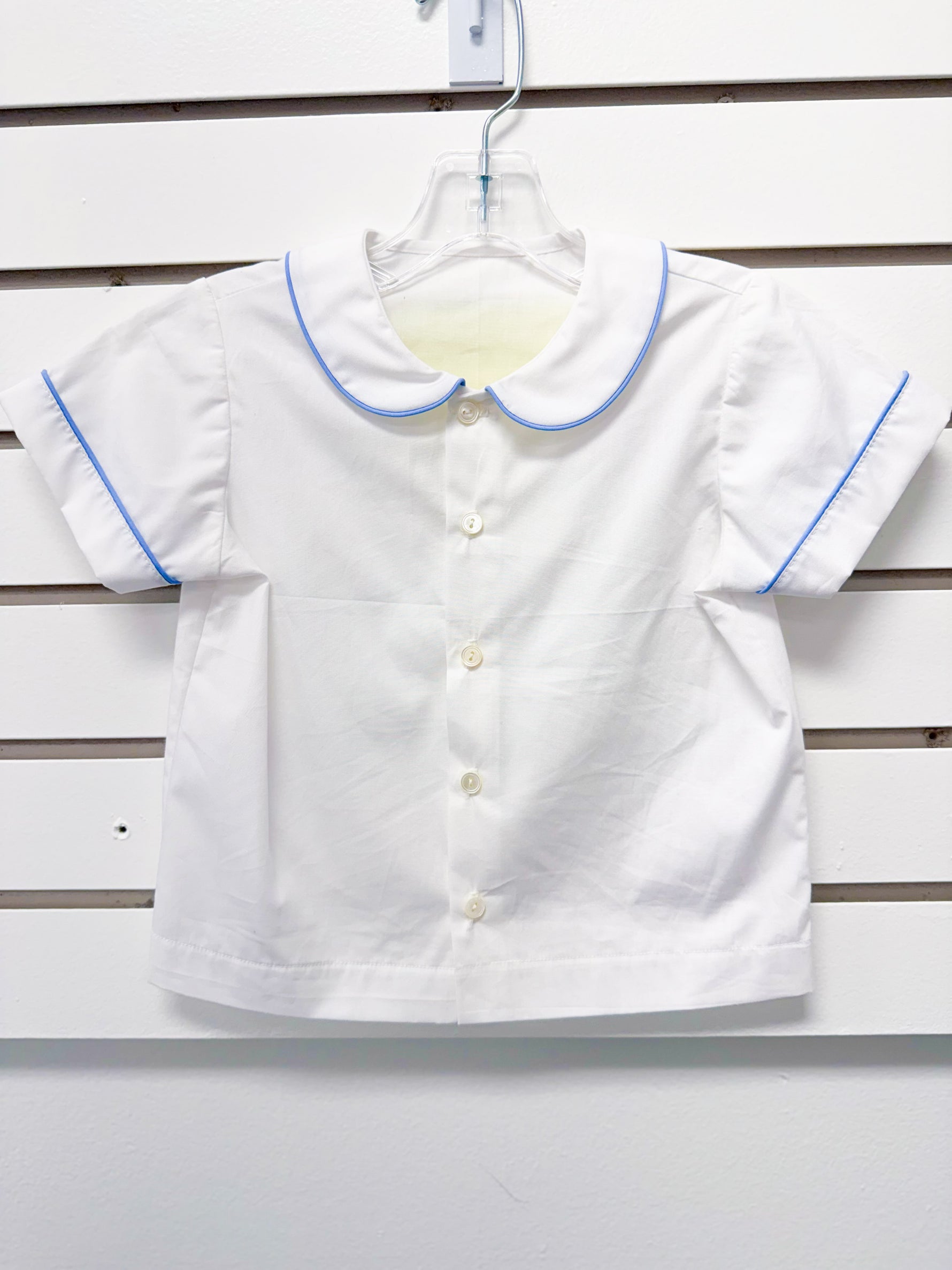 White toddler boy short-sleeve shirt with blue piping trim and Peter Pan collar