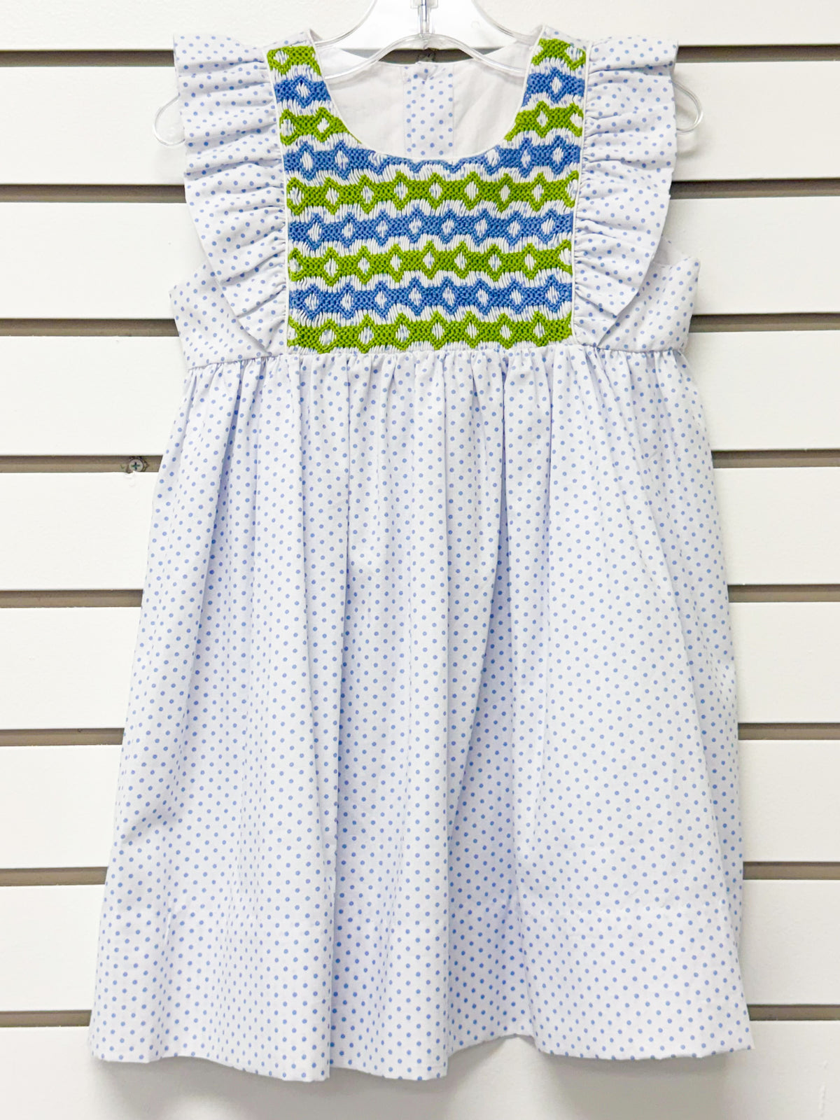 Girl's white polka dot dress with blue and green smocked yoke and ruffle sleeves