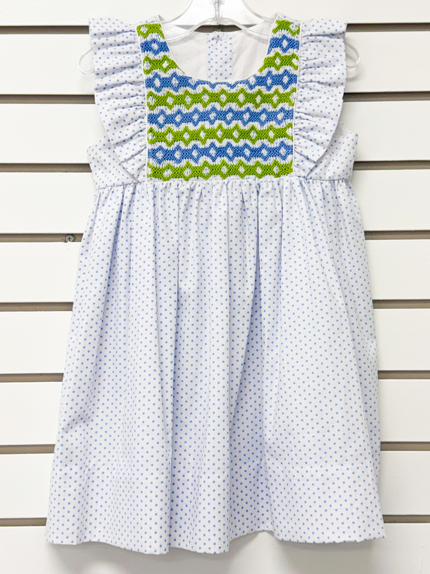Girl's white polka dot dress with blue and green smocked yoke and ruffle sleeves