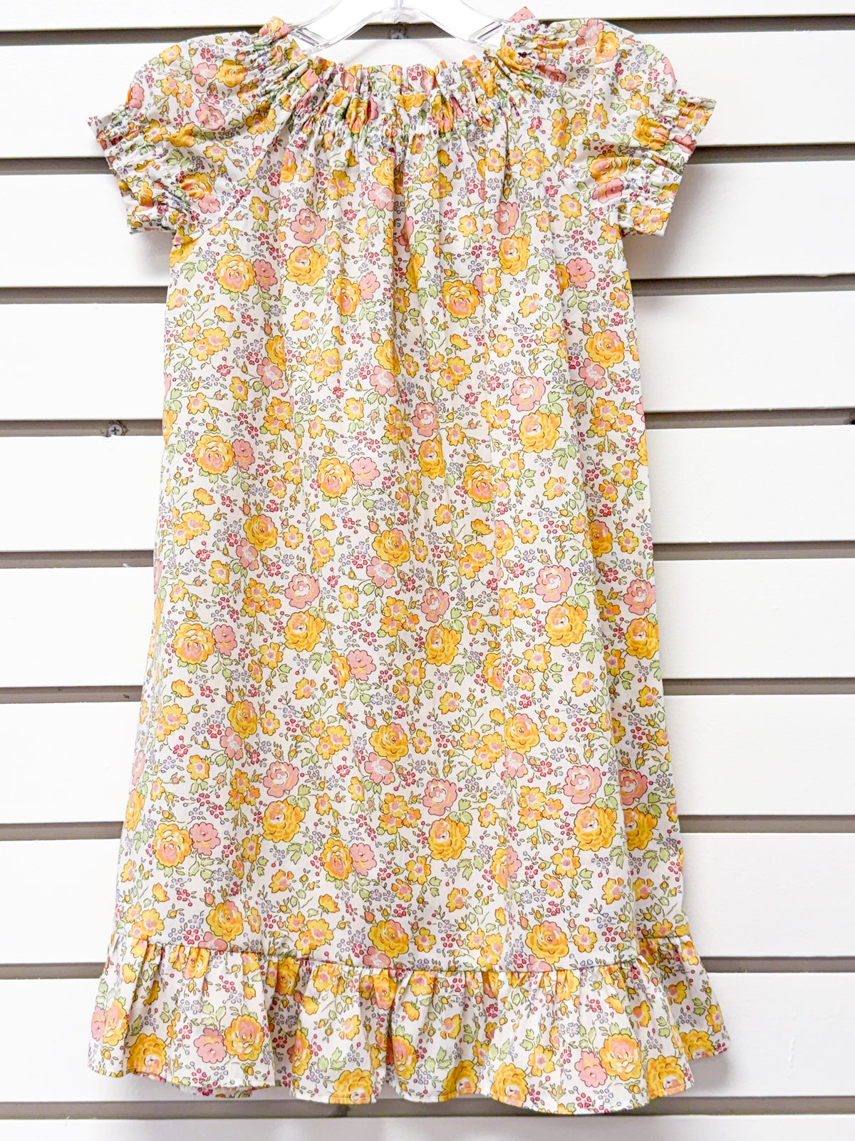 Girl's floral nightgown in yellow and pink roses with ruffle hem and sleeves