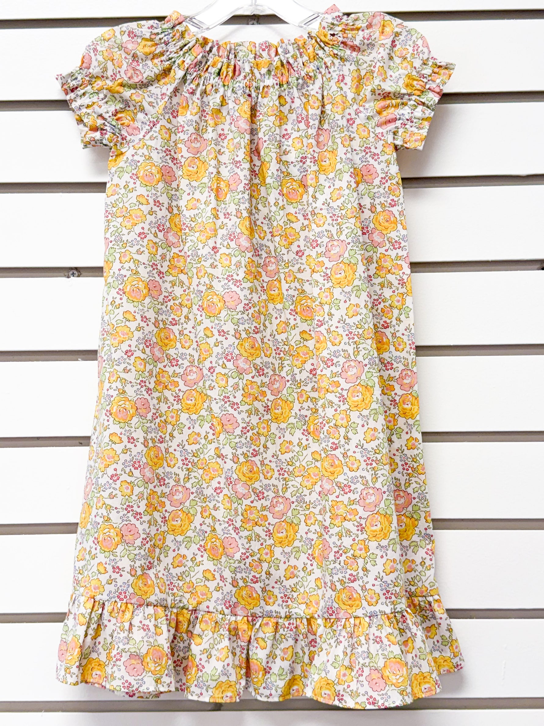 Girl's floral nightgown in yellow and pink roses with ruffle hem and sleeves