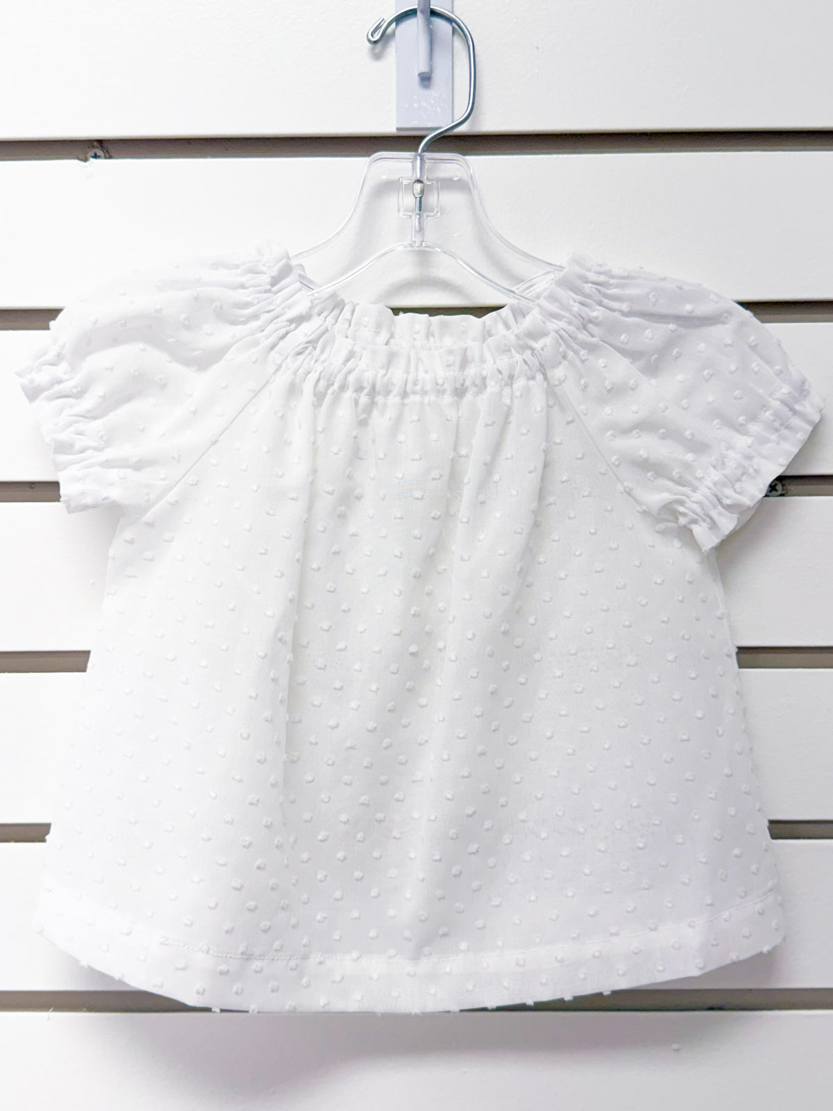 White swiss dot off-shoulder toddler tunic with puff sleeves, size 12 months
