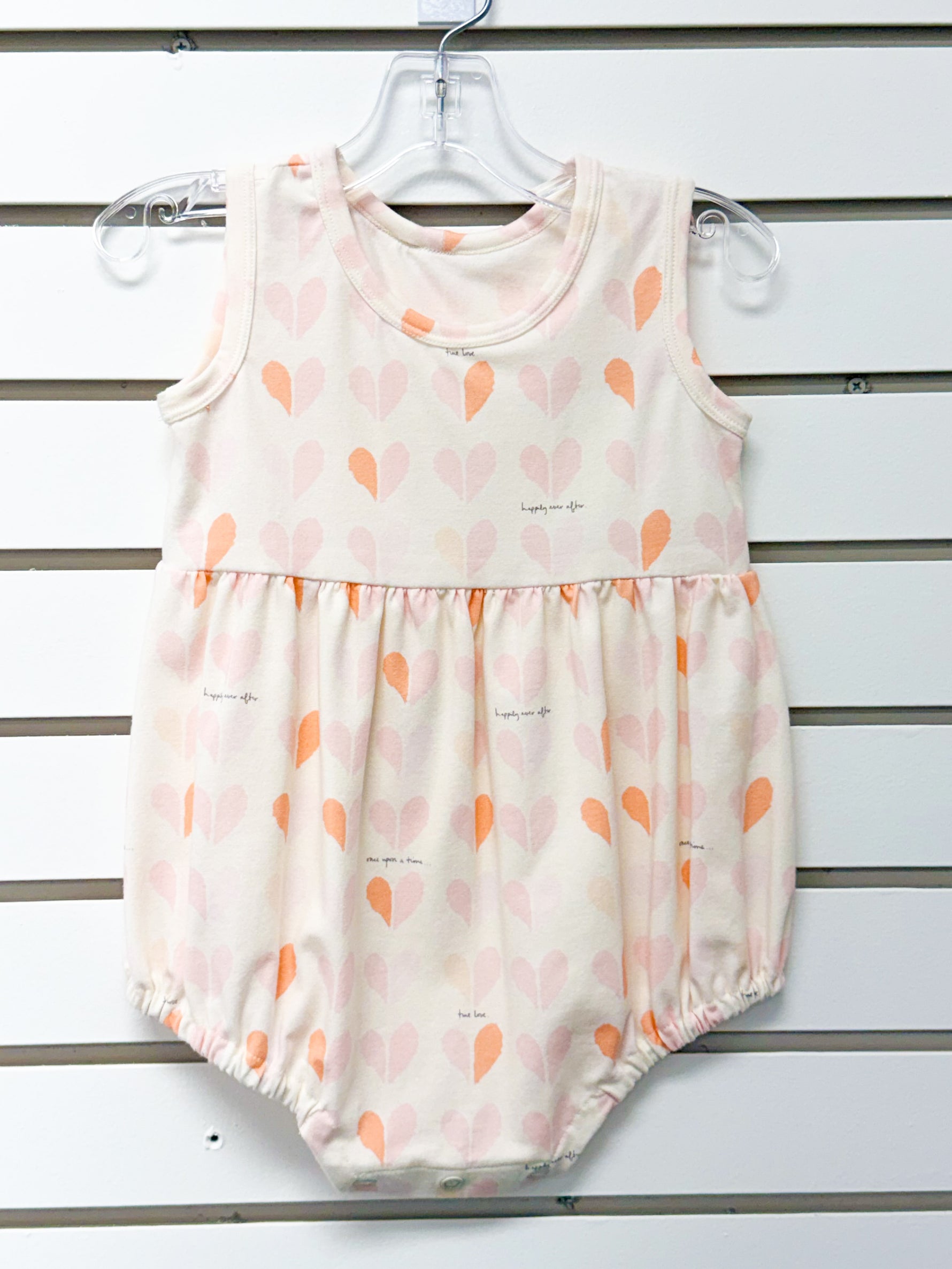 Baby girl cream sleeveless romper with pink and peach heart print, size 18mo