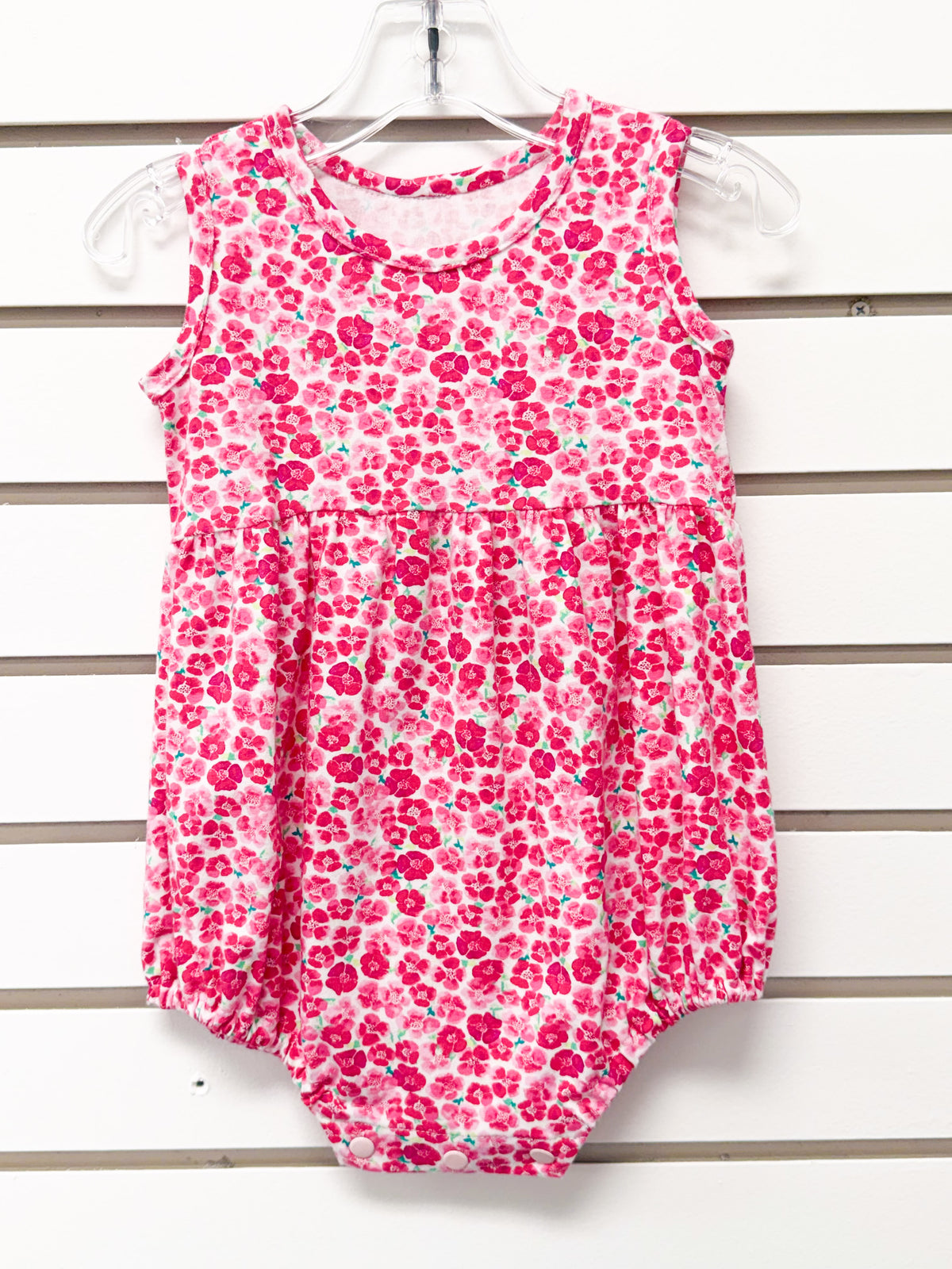 Baby girl pink floral sleeveless bubble romper with snap closure, size 18 months