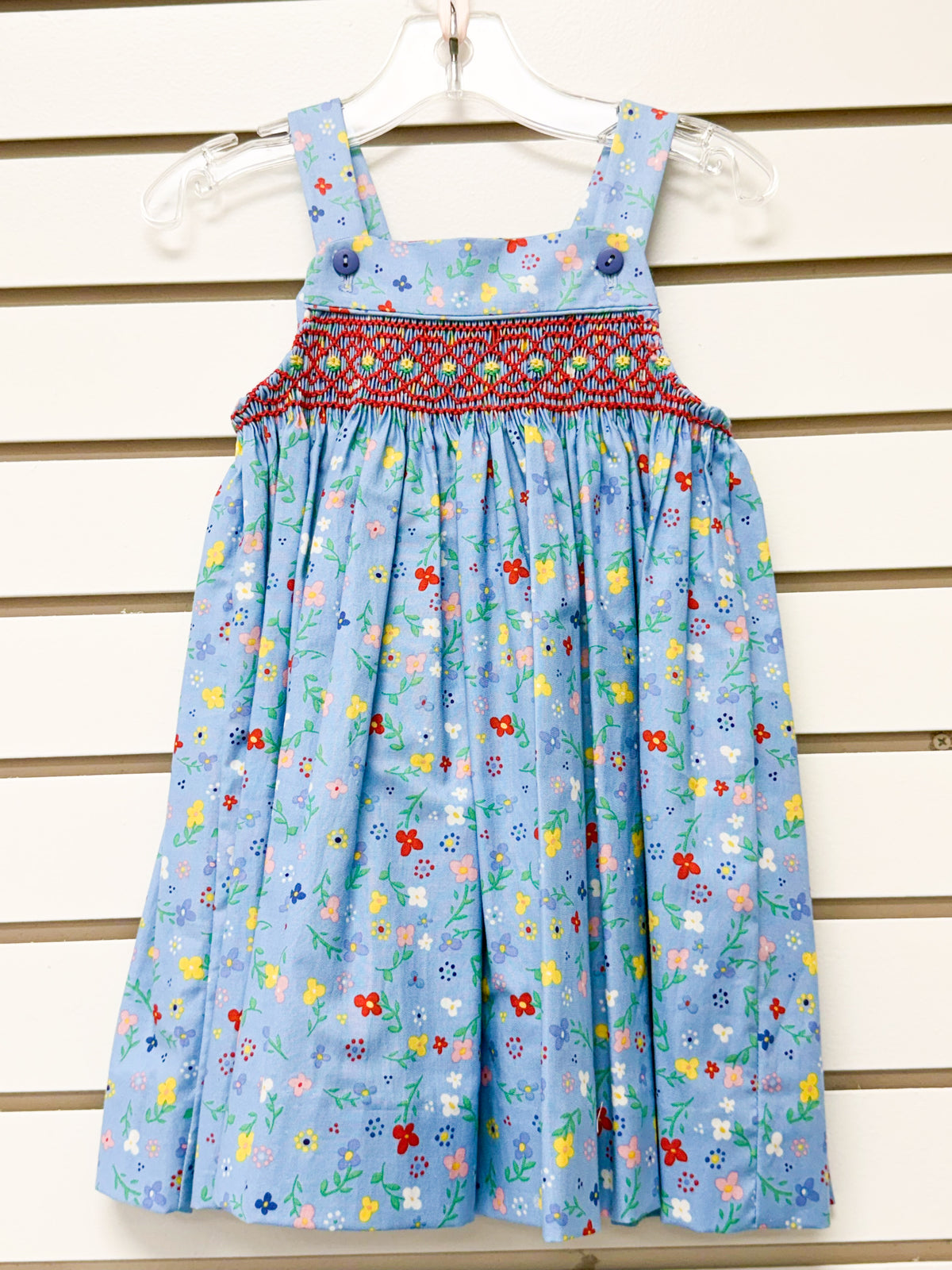 Light blue floral smocked sundress with red embroidery and blue buttons, size 3
