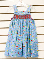Light blue floral smocked sundress with red embroidery and blue buttons, size 3