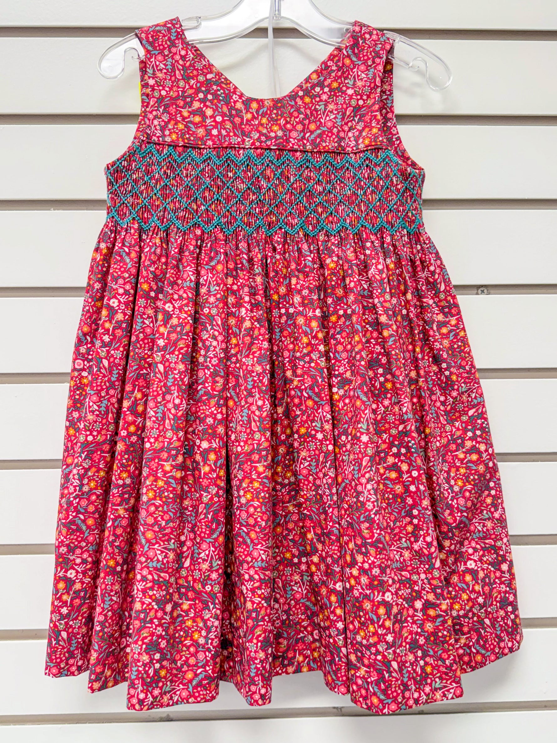 Red floral sleeveless girls dress with teal smocked bodice, size 3