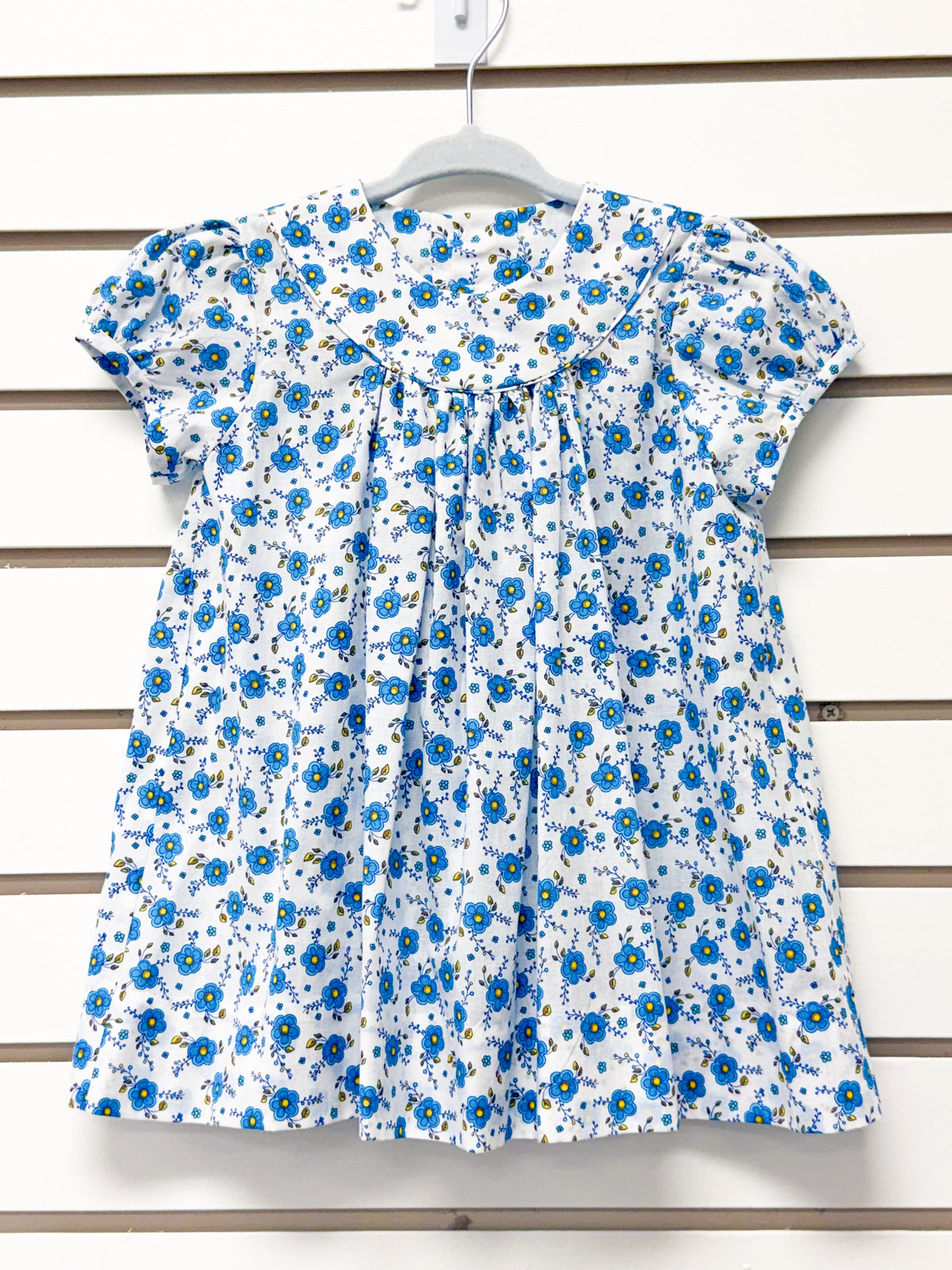 White short sleeve toddler dress with blue floral print and peter pan collar