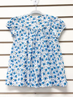 White short sleeve toddler dress with blue floral print and peter pan collar