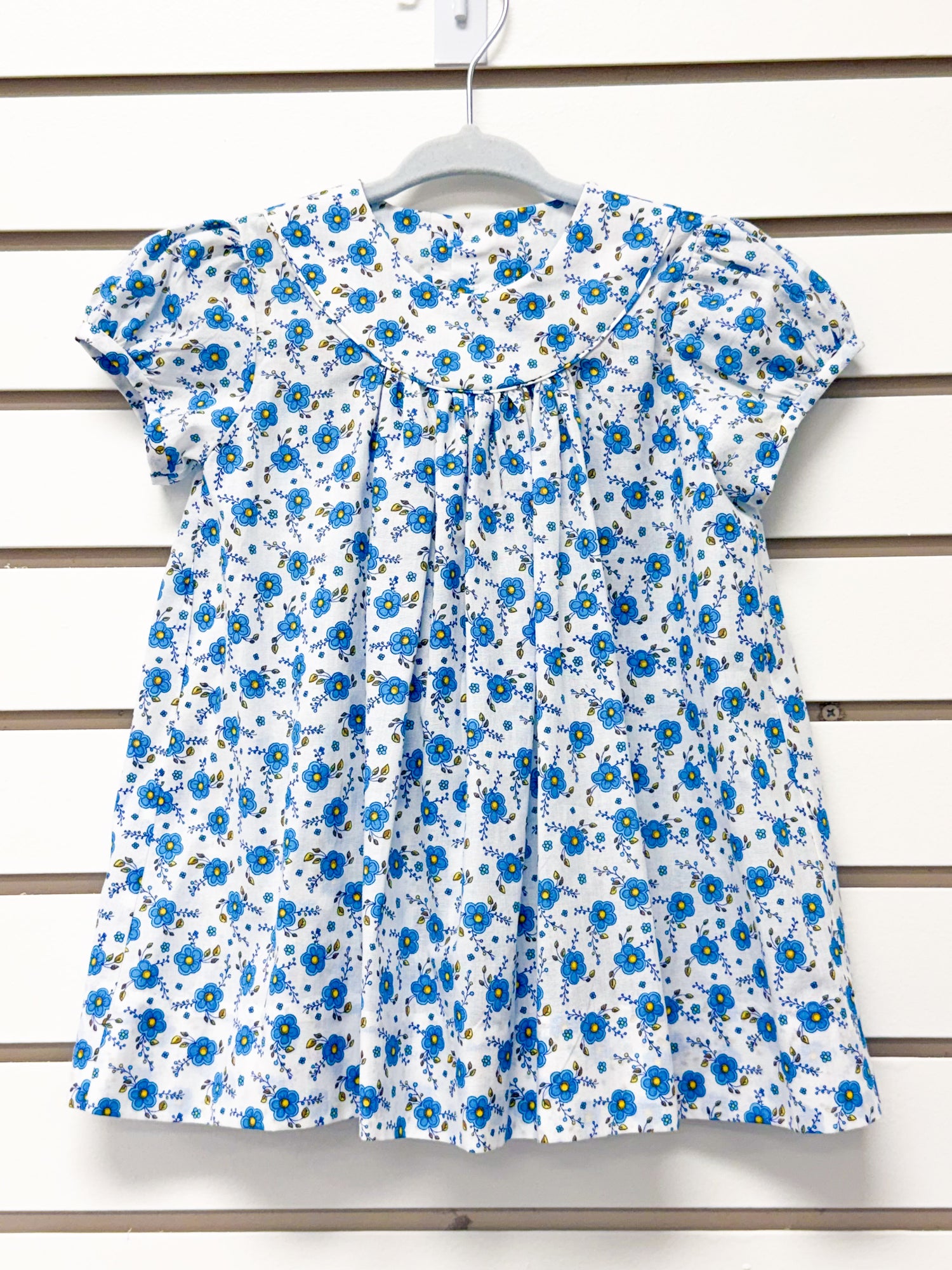 White short sleeve toddler dress with blue floral print and peter pan collar