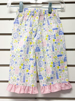 White children's pants with London landmarks print and pink gingham ruffle hem