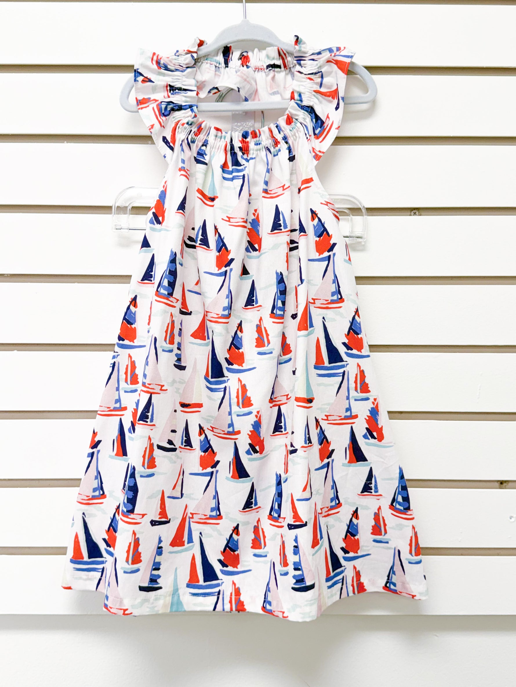 White toddler halter dress with red and navy sailboat print, flutter neckline, size 3