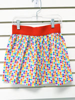 Girls size 4 elastic waist skirt with colorful rainbow hearts print and red waistband