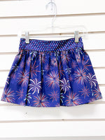Navy blue gathered skirt with fireworks print and star-patterned waistband, size 4