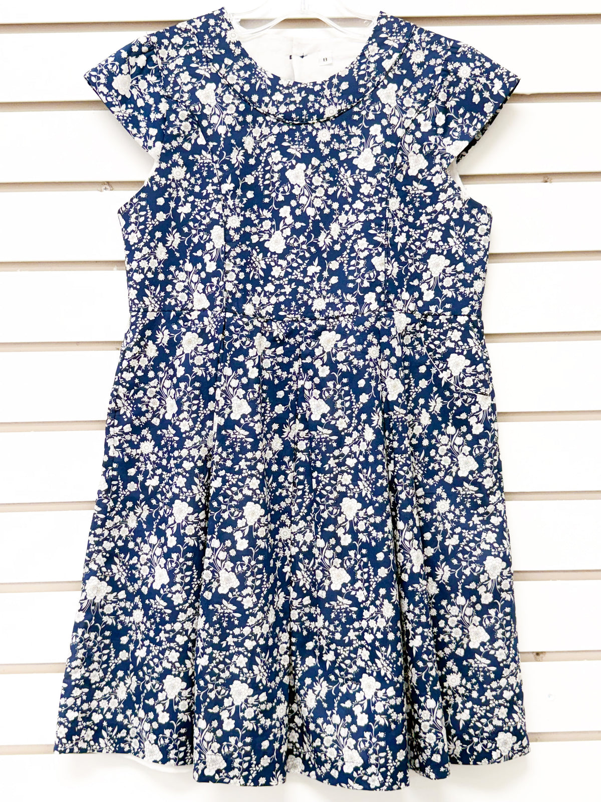Girls navy blue floral fit-and-flare dress with ruffle collar, size 7 sample