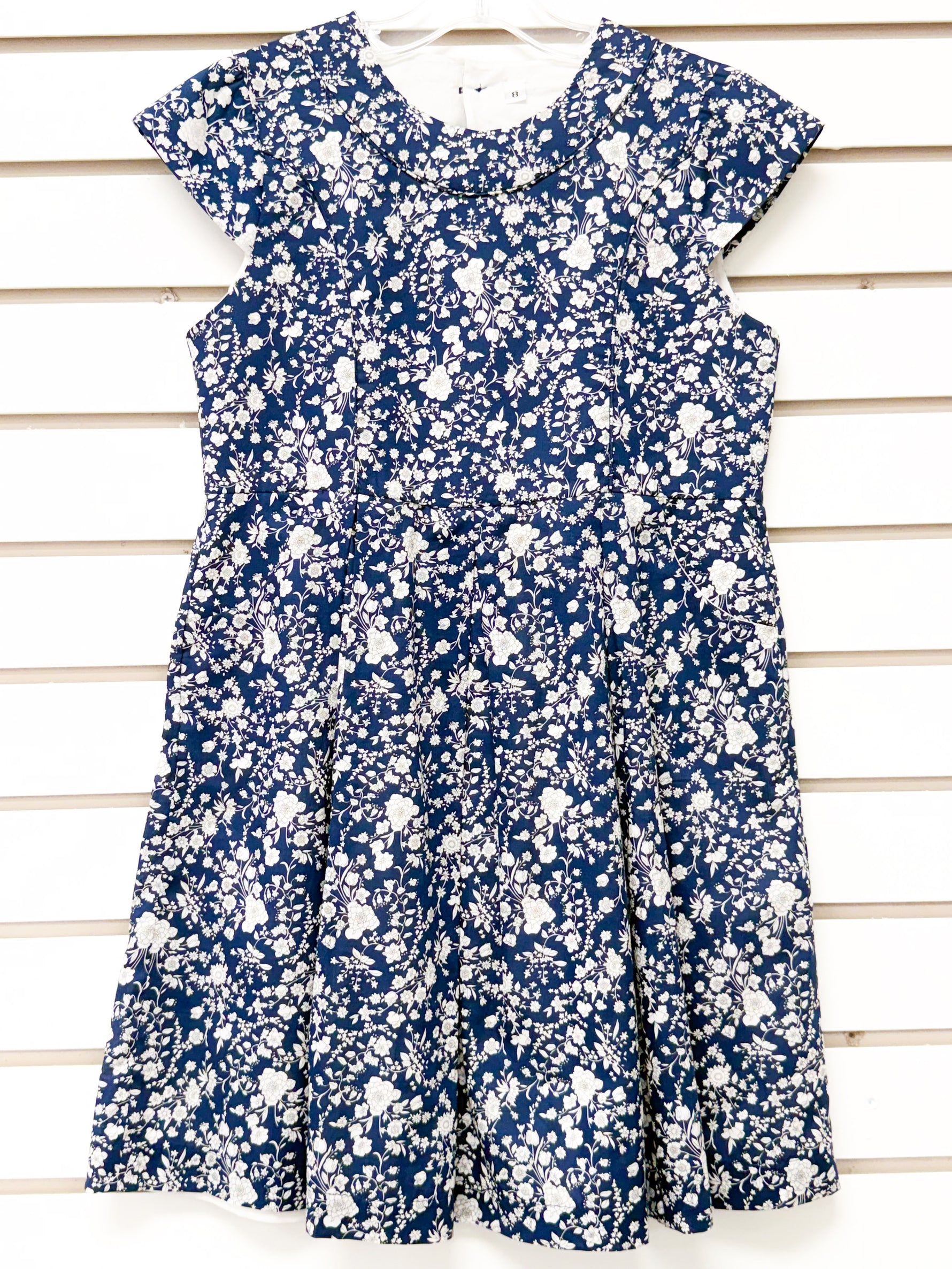 Girls navy blue floral fit-and-flare dress with ruffle collar, size 7 sample