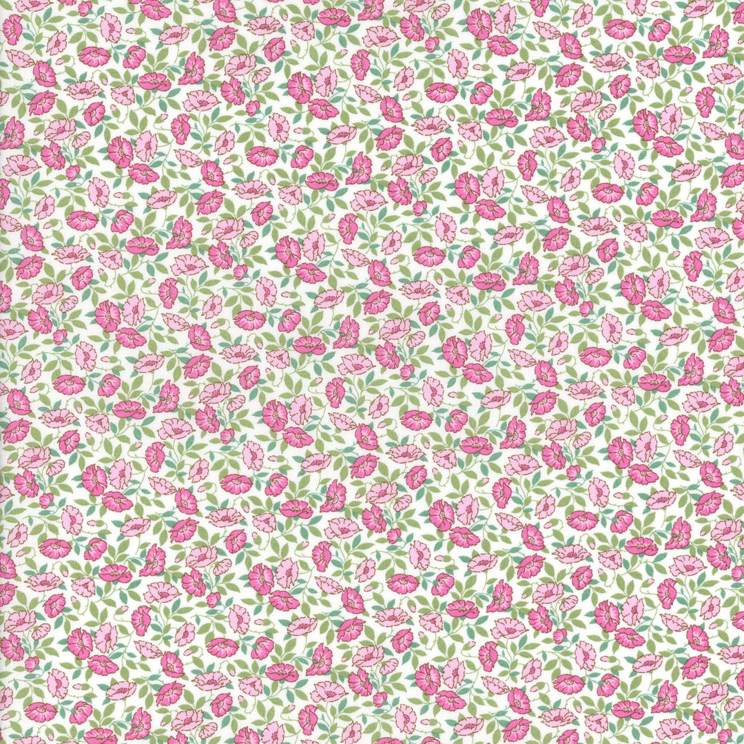 White cotton fabric with pink floral and green leaf allover print pattern