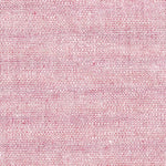 Close-up of red and white woven chambray fabric with subtle speckled texture