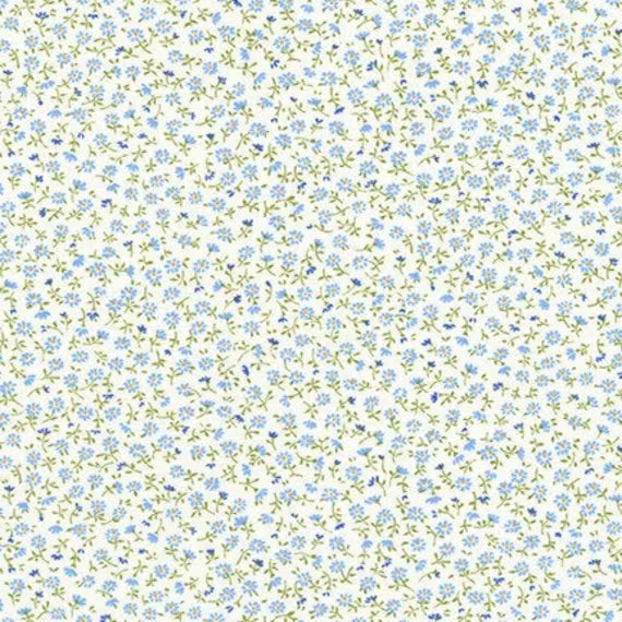 Cream fabric with scattered blue daisy flowers and green vines allover print