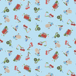 Light blue fabric with tossed holiday construction vehicles in red, green, and blue