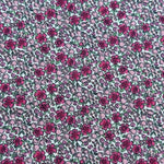 Raspberry Punch Floral fabric with dense pink and magenta flowers on white background