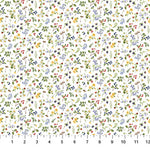White cotton fabric with scattered small wildflowers, berries, and green leaves pattern