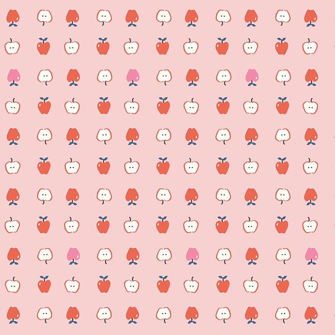 Pink cotton fabric with repeating red and pink apple halves and whole apple pattern