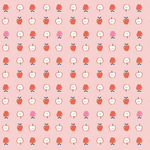 Pink cotton fabric with repeating red and pink apple halves and whole apple pattern