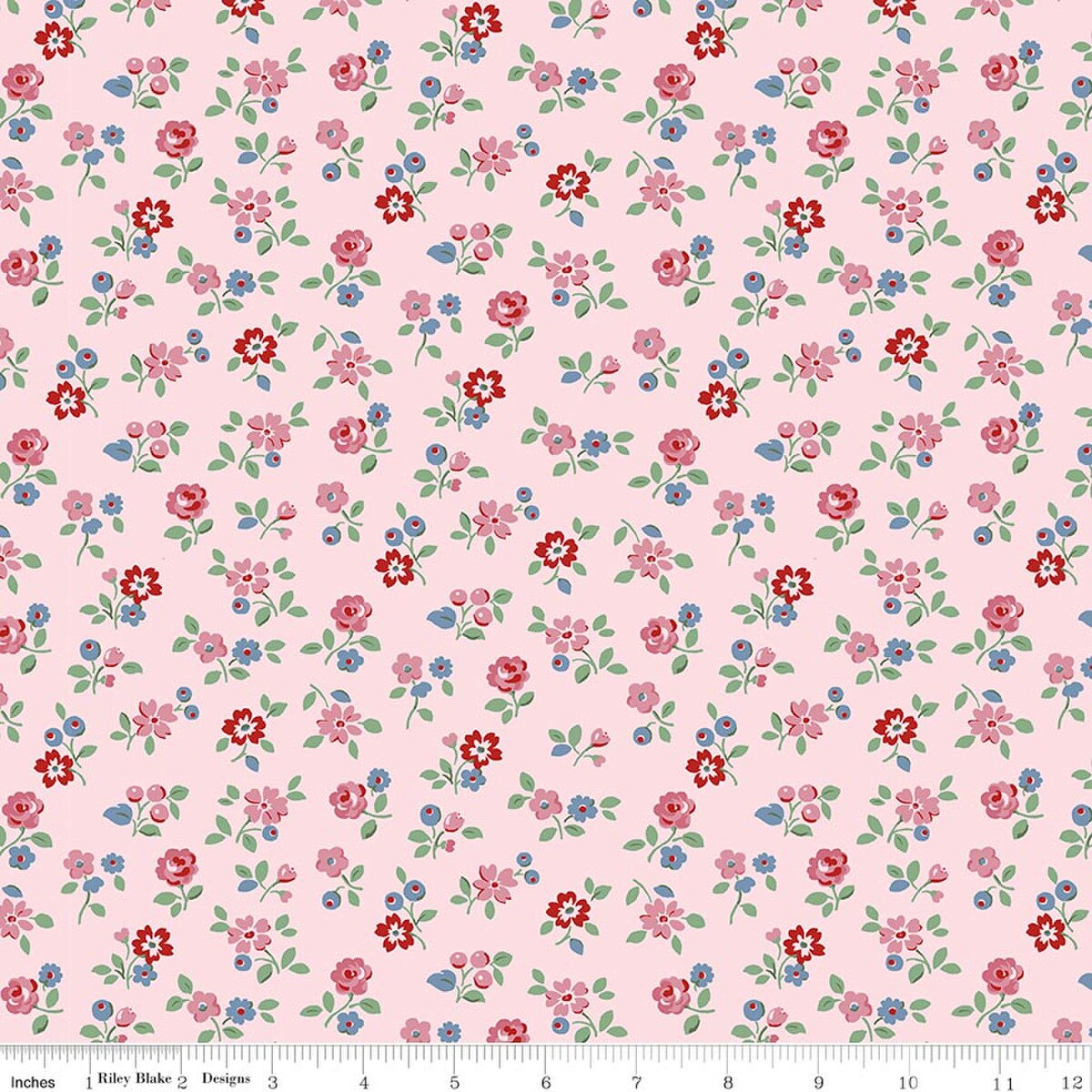 Pink cotton fabric with scattered ditsy floral print in red, pink, and blue