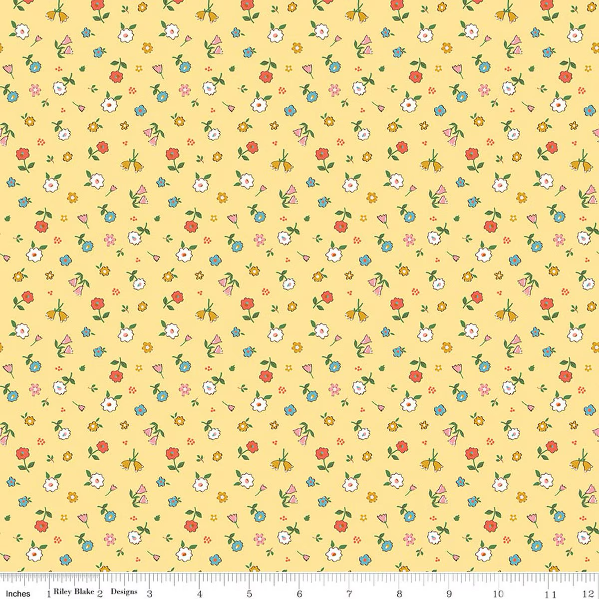 Yellow cotton fabric with scattered multicolor small floral ditsy print by Riley Blake
