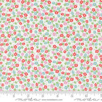 White quilting fabric with scattered red, pink, and blue floral ditsy print
