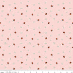 Pink cotton fabric with scattered red ladybugs and white daisy flowers pattern