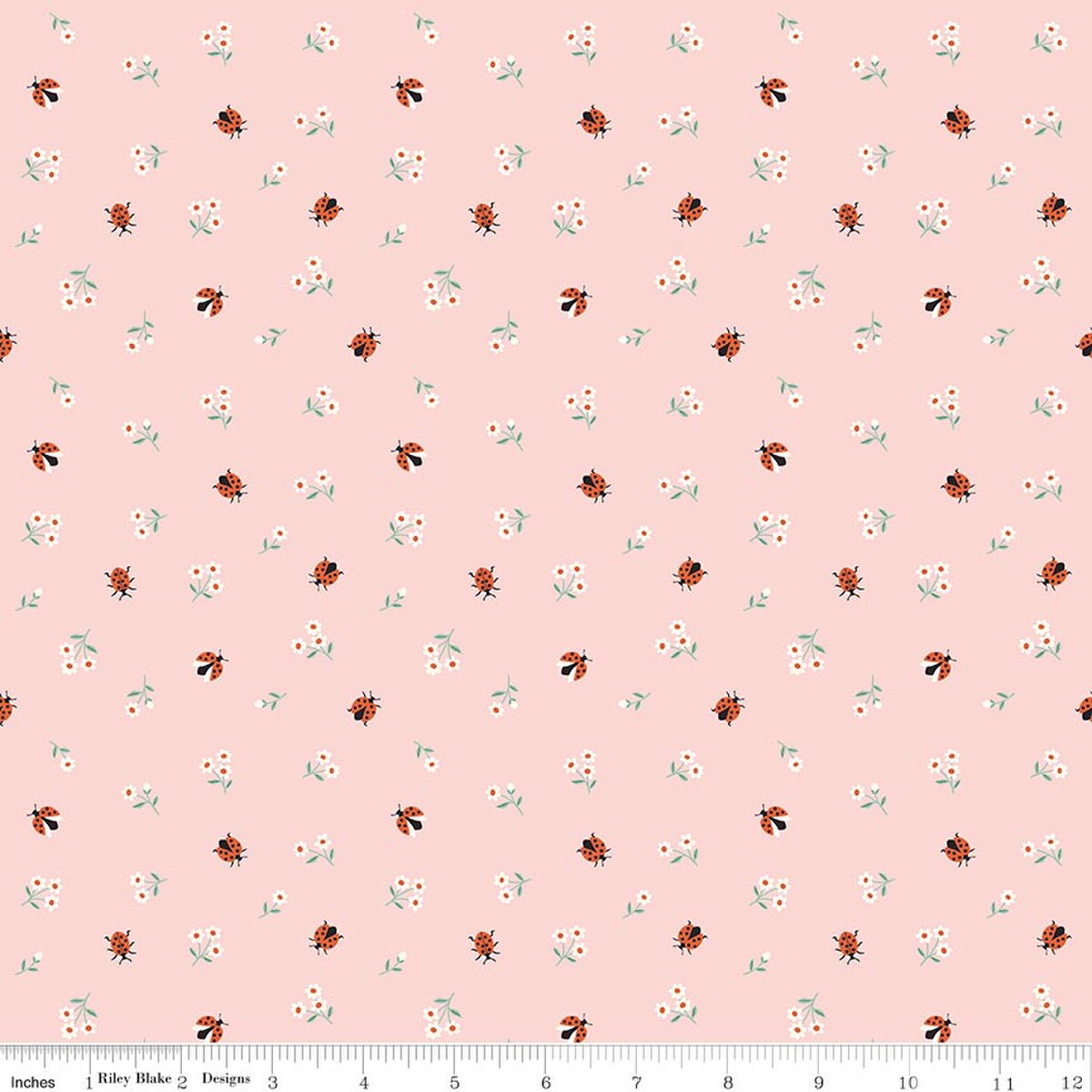 Pink cotton fabric with scattered red ladybugs and white daisy flowers pattern