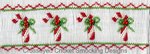 Smocked white fabric with embroidered candy canes, holly, and red zigzag borders.