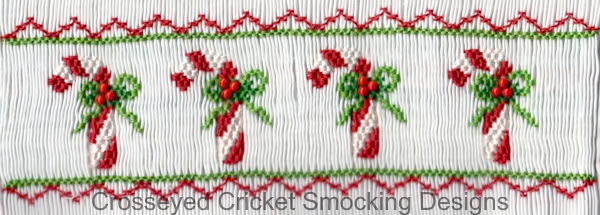 Smocked white fabric with embroidered candy canes, holly, and red zigzag borders.