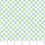 Blue and green diagonal plaid flannel fabric on white background